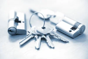 Set of keys and lock cylinders representing security and locksmith services. -locksmith services