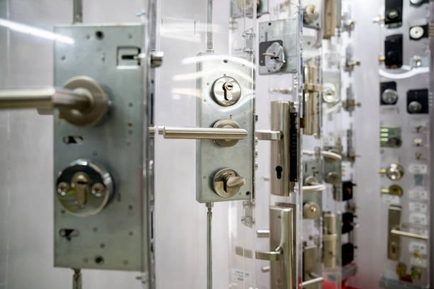 Display of various modern door locks and handles for security. -commercial locksmith services